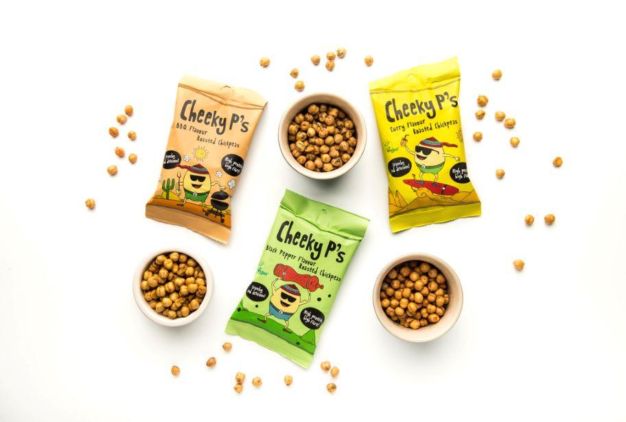 Packets and bowls of Cheeky P's snacks shot from above