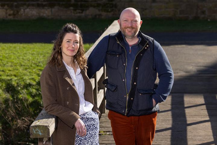 Winter addis and David Towns from Muckle LLP standing left to right on a bridge