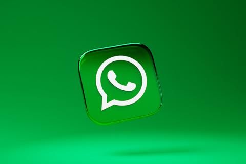 The WhatsApp logo on top of a green background
