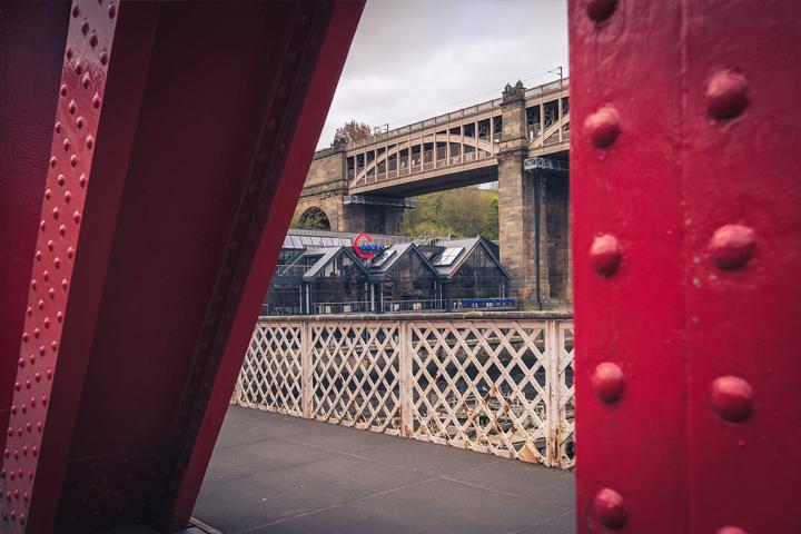 aspire office viewed through a red bridge