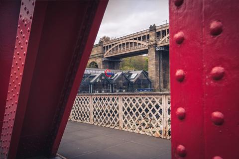 aspire office viewed through a red bridge