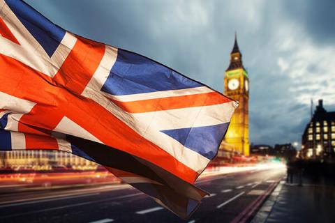 The Union Jack flag flying in front of the Houses of Parliament