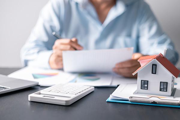 Solicitor completing paperwork for housing transaction
