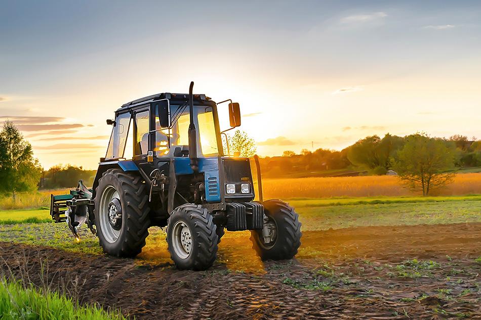 Tractor being driven on farm land