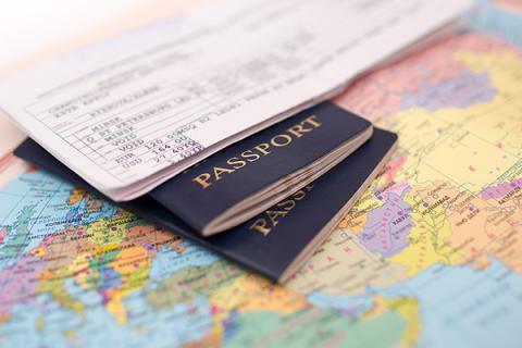 Two passports, a map and immigration documents photographed together