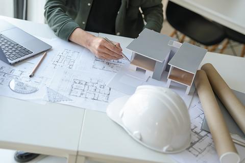 Construction meeting taking place with two parties signing documents
