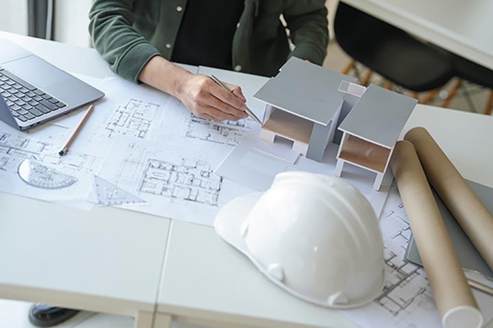 Two people discussing a construction project in an office