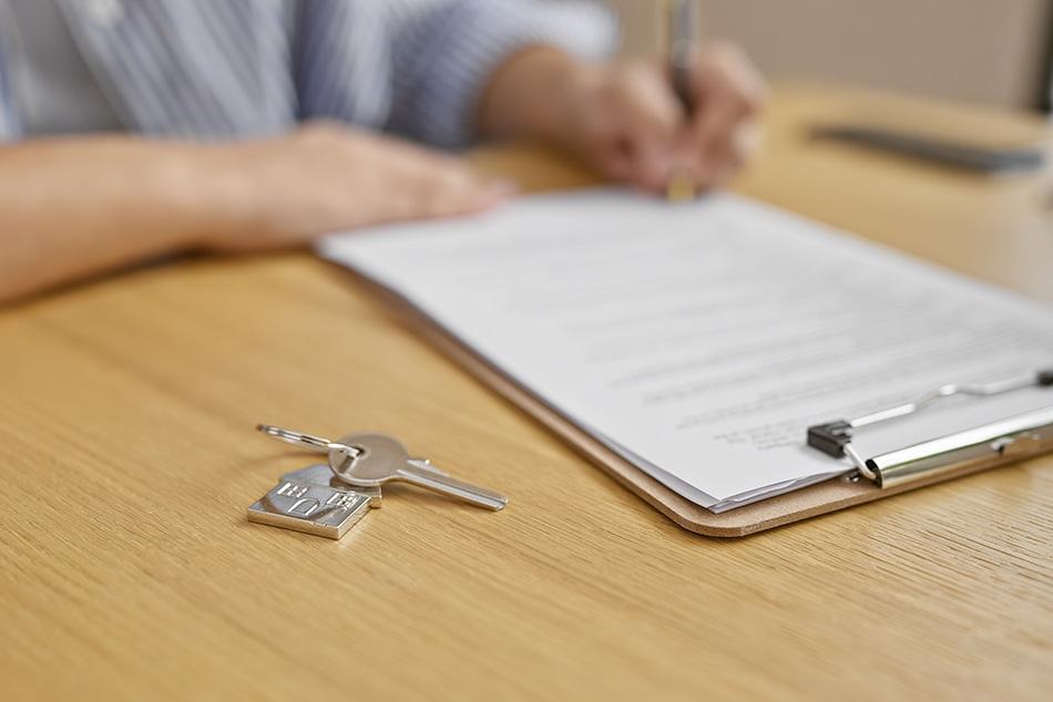 Image of someone signing tenancy agreement