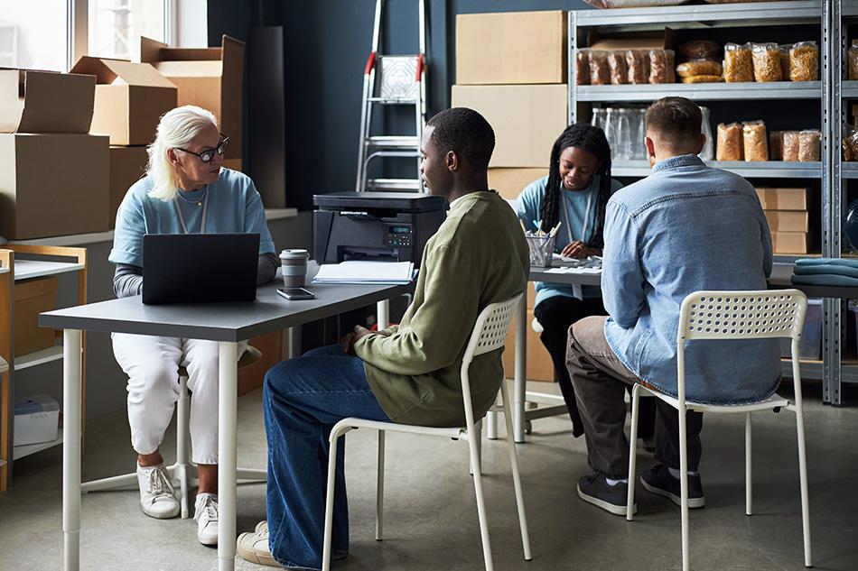 Employees of a charity engaging in a meeting