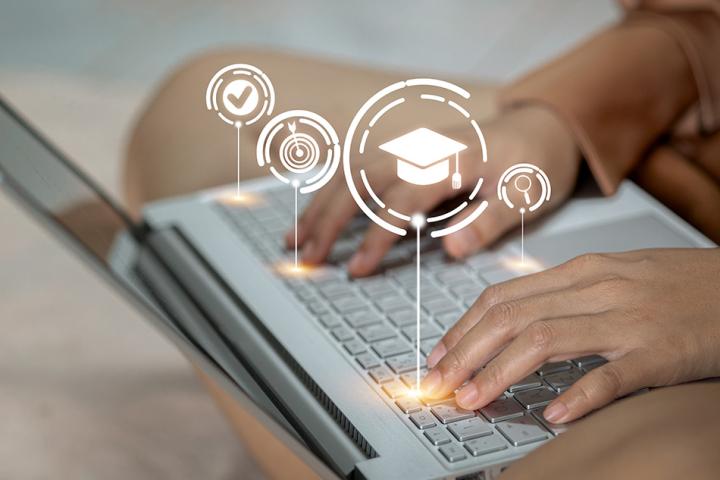Woman browsing education website on laptop