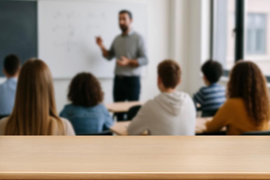 Male teacher teaching in a classroom setting