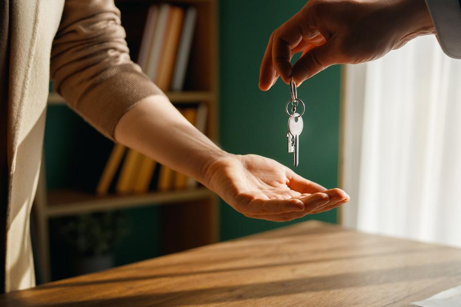 Image of person accepting keys for new rental property