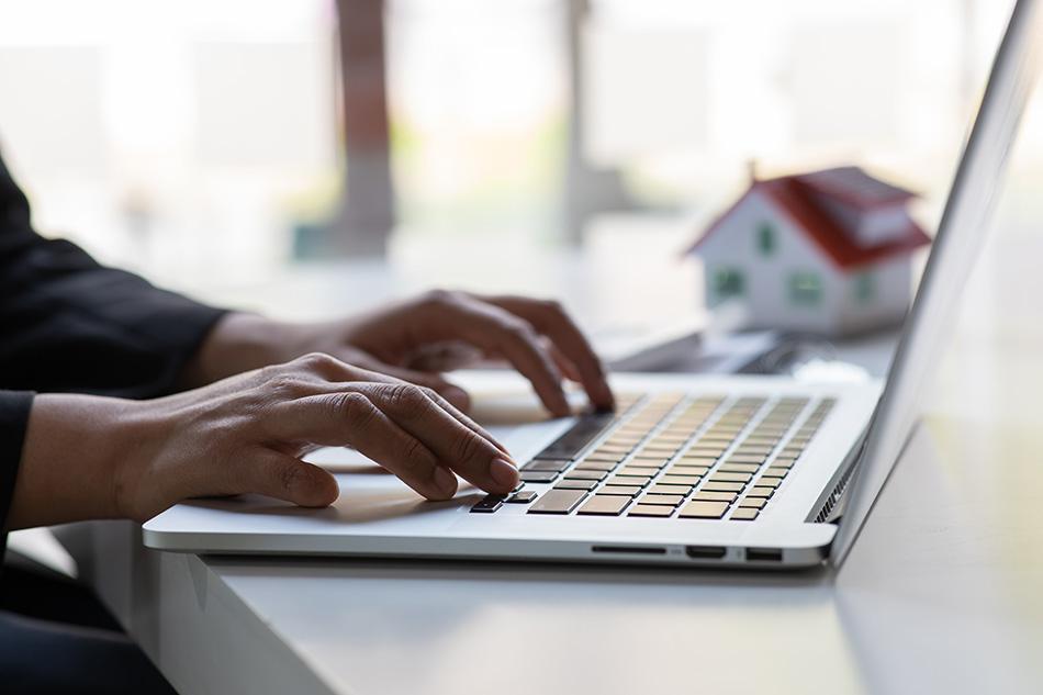 A tenant using a laptop in an office setting