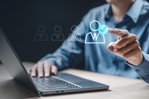 Image of a man conducting business on a digital screen