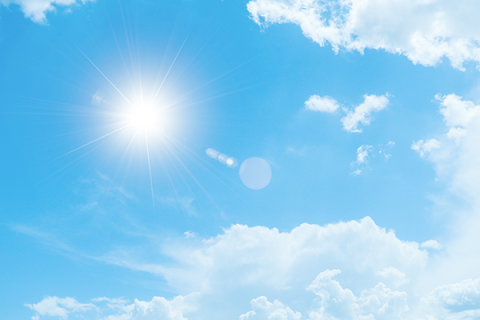 A blue sky with clouds on a hot day