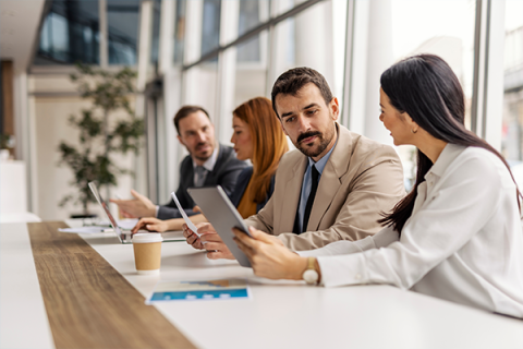 Colleagues holding a meeting in an office setting