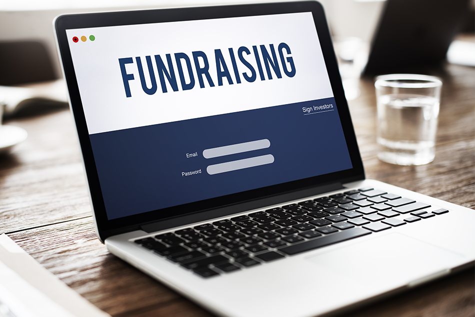 Image of a laptop screen with a fundraising web page loaded