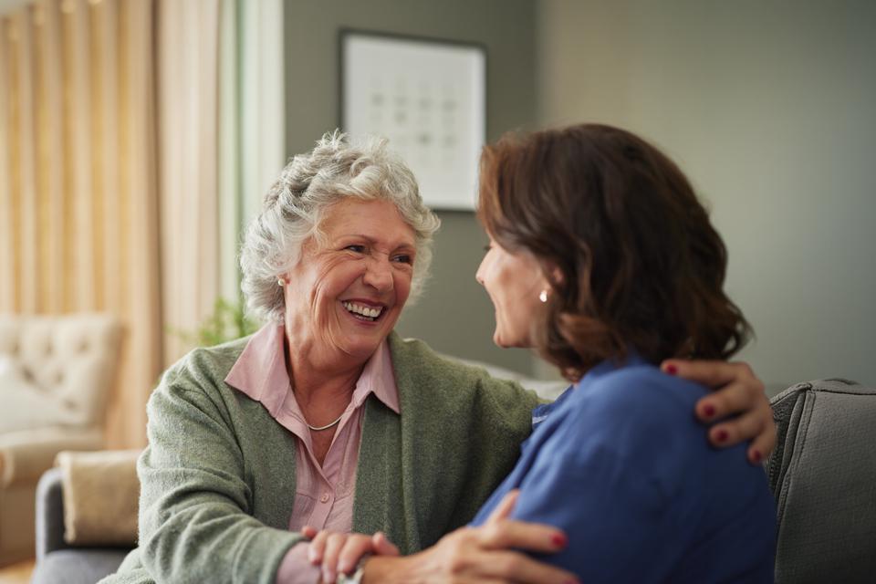 elderly lady talking to her daughter