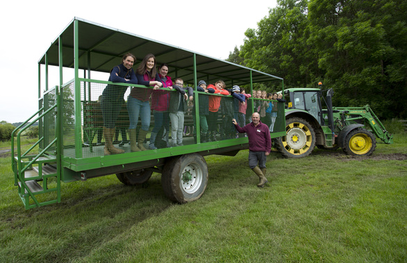 Farmyard fun: Teachers and students from St Lawrence RC Primary School, Byker, with David Thompson (The Country Trust) and Beth Thompson and Elizabeth Earle (Muckle LLP) at Broxfield Farm.